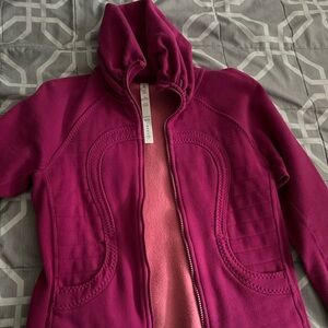 Lululemon zip up sweater. It zips up to your neck.